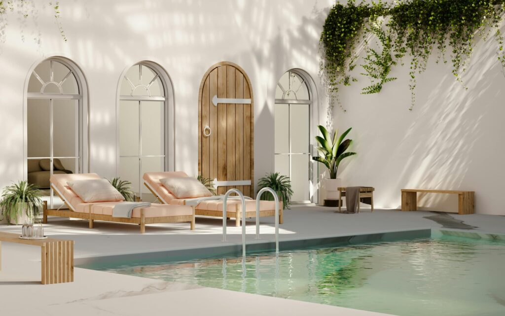Patio mediterráneo con materiales naturales, vegetación y zonas de sombra.