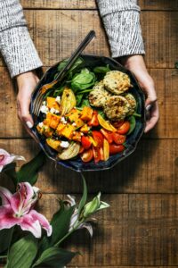 Fresh seasonal ingredients laid out on a kitchen table with natural light